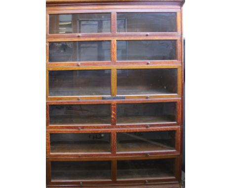 A Globe Wernicke style oak six section bookcase bearing inscription plaque 198cm high, 128cm wide 