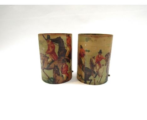A pair of cylindrical fibreglass lamp shades depicting huntsmen in scarlet jackets on horseback with hounds.