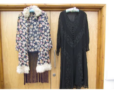 A 1920's black chiffon and lace dress, inserts of lace throughout, V shape neckline with covered button detail, belt, a/f and