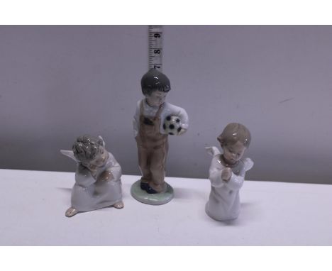 A Nao football boy figurine and two Lladro angels 