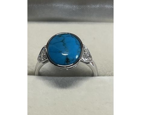 A hallmarked silver and turquoise ring 