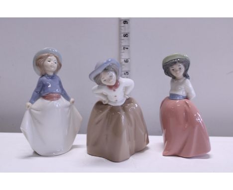 Three Nao figurines 