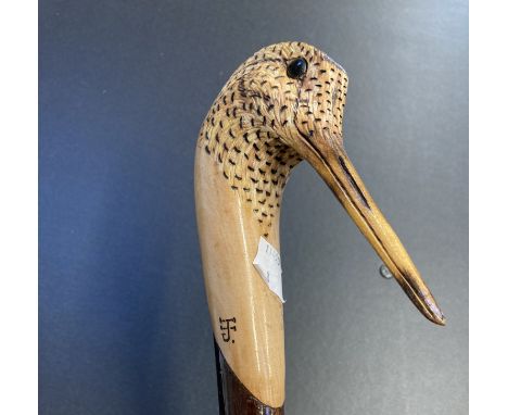 * Walking Stick. A walking stick with woodcock terminal, hand carved by Ian James, 136cm longQTY: (1)NOTE:Ian James is one of