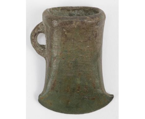 * Bronze Age. A bronze axe head, circa 1000-800 B.C., oval hollow aperture and flared head, a rich green patina throughout, 5