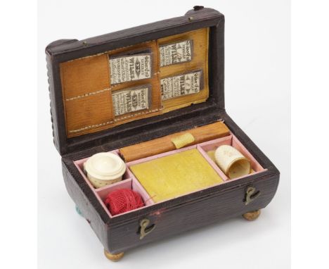* Sewing. A Regency miniature sewing box, circa 1820s, brown morocco-covered box of sarcophagus form on bun feet, the hinged 