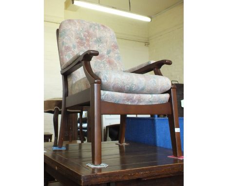 A floral upholstered button back armchair