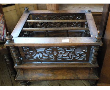A Walnut Canterbury with single drawer and fretwork surround