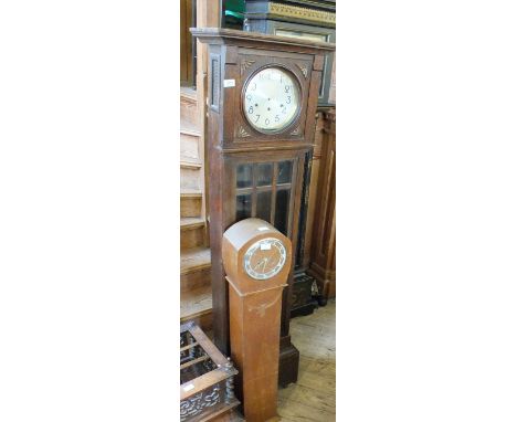 An Oak cased eight day Grandfather clock and a Grandmother clock
