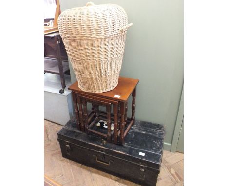 A tin trunk, a nest of three Mahogany tables and a wicker linen basket