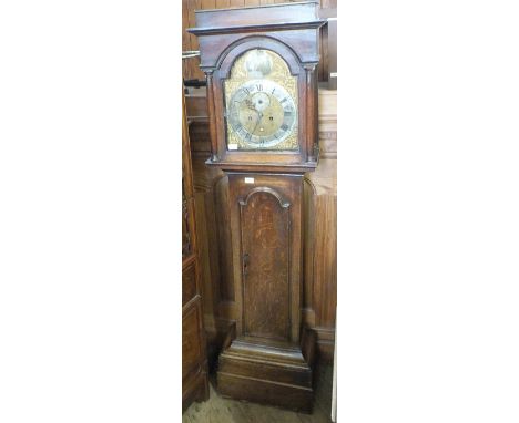 An Oak eight day longcase clock with Brass dial marked Val. Downs, Louth. Valentine Downs is recorded as working in Louth, Li