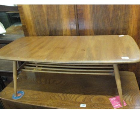 A light Elm Ercol coffee table with shelf below 