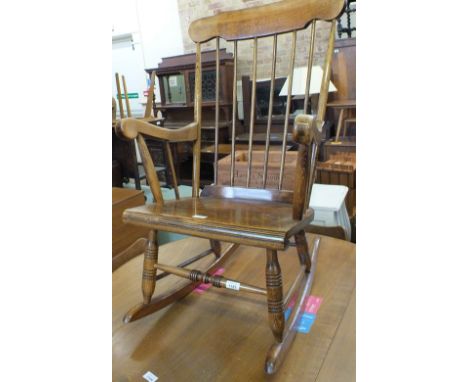 A stick back rocking chair