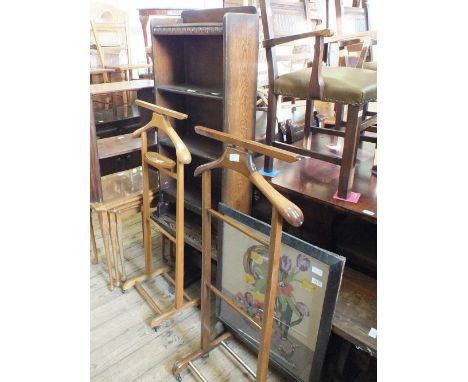 A floral tapestry firescreen, a small three shelf Oak bookcase, an oval mirror and two suit stands