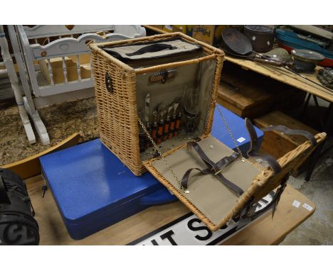 Wicker picnic hamper and a folding picnic table.