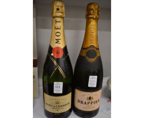 A bottle of Moet and Chandon Champagne and a bottle of Drappier Champagne.