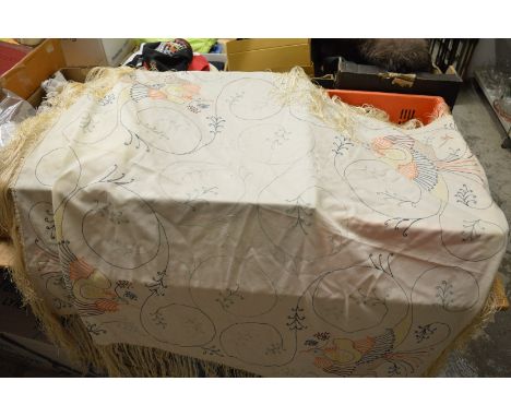 An embroidered shawl.