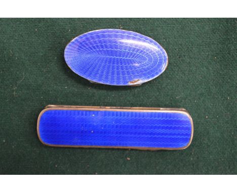 A silver and enamel toothpick box and a silver and enamel pill box.