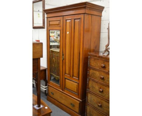 A Victorian walnut wardrobe.