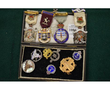A quantity of enamel and other badges.