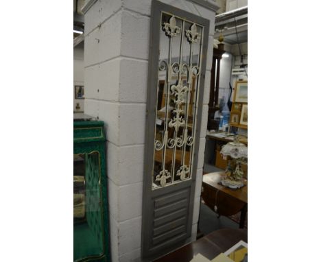 A pair of decorative shutter style grey painted mirrors.