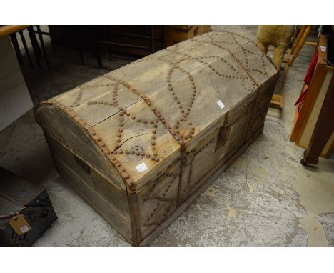 An early metal studded pine dome top trunk.