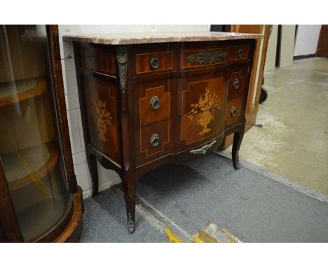 A French style mahogany, marquetry and ormolu mounted marble top three drawer commode.
