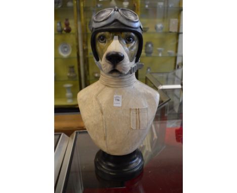 An amusing resin bust of a dog wearing crash helmet and goggles.