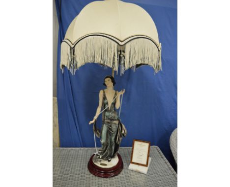 A large decorative figural table lamp.