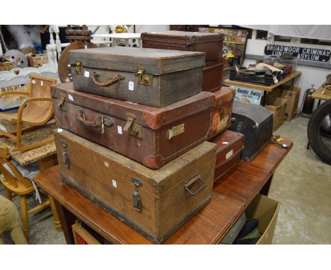 A quantity of luggage, storage boxes and a car trunk.