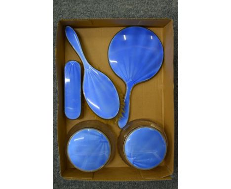 A silver and enamel five piece dressing table set.