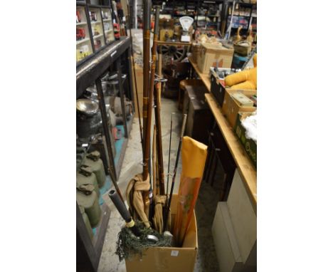 Various fishing rods and landing net.