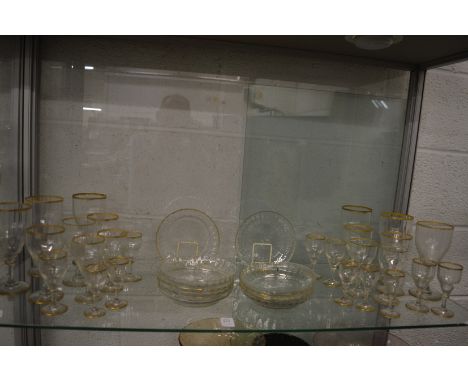 Part suite of glassware with gilded rims.