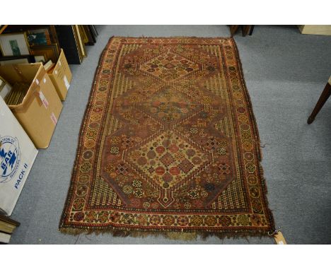 An old Persian rug, 190cm x 120cm.