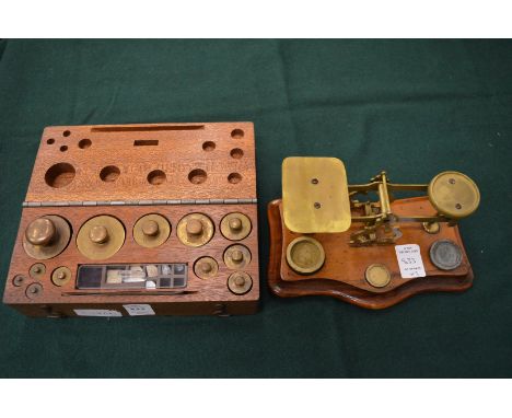 A box set of weights and postal scales and weights.