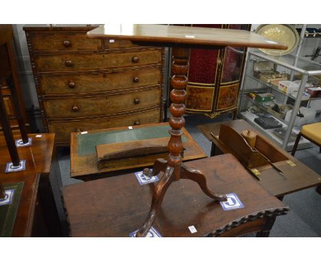 A mahogany tripod table.