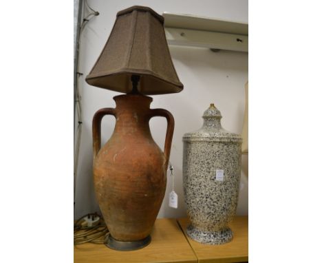 A terracotta twin handled lamp and another lamp base.