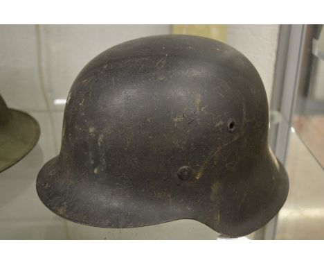 A German military helmet with leather liner.