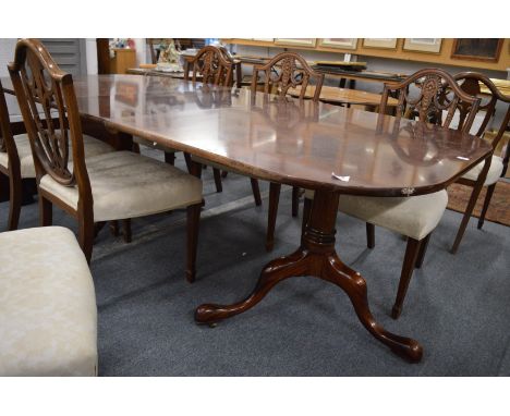 A good Georgian style mahogany twin pillar dining table with two leaves.