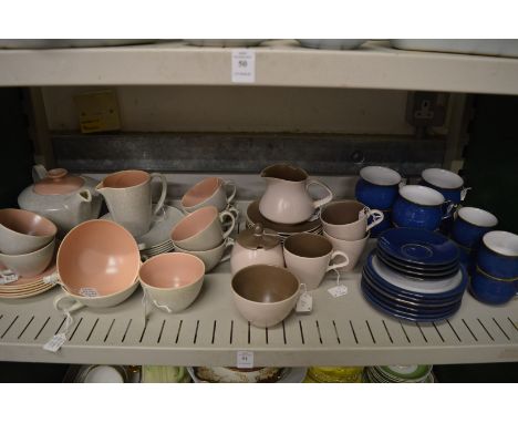 A quantity of Poole pottery and Denby coffee cups, saucers and plates.