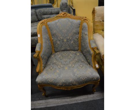 A French fauteuil with gilt wood frame.