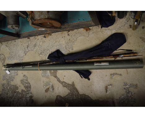 A Century Eliminator three piece fly fishing rod with cardboard storage tube.