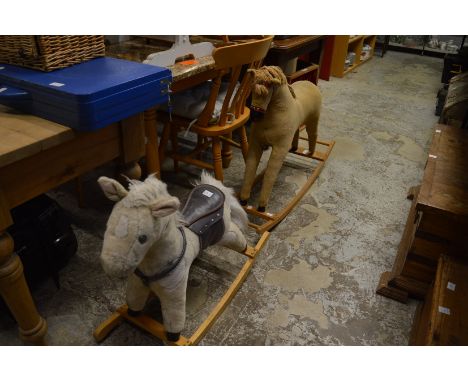 Two rocking horses and a puppet theatre.