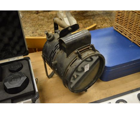 A hand held Tilley lamp.
