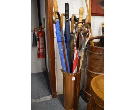 Copper stick stand and contents.
