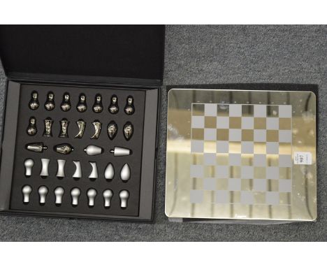 An Aquascutum travelling chess set.