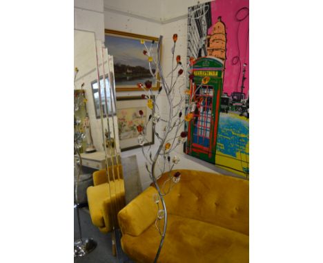 An ornate chrome plated floor standing lamp of a flowering tree design.