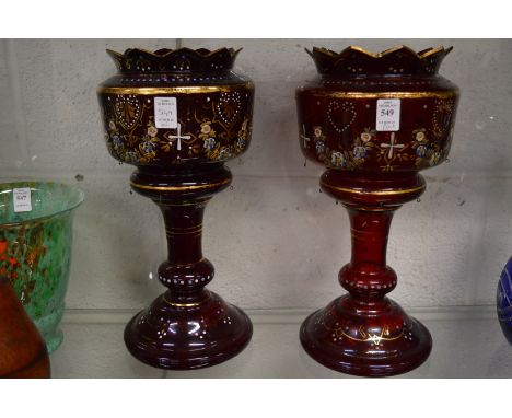 A pair of Victorian ruby glass and gilt decorated lustre bodies.