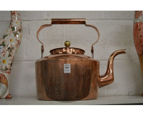 A large copper kettle.