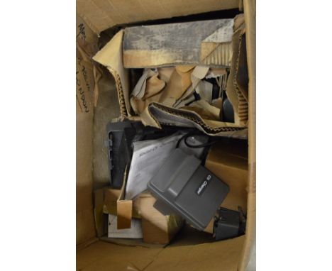 Quantity of unused spares for a Sinclair C5 electric car to include a car charger.