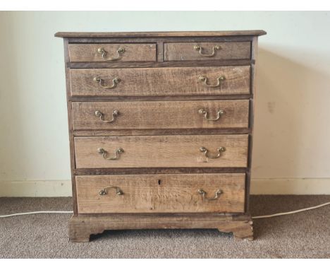 An 18th Century stripped oak Chest of two short over four long graduated drawers raised on bracket feet (replacement back) 2f
